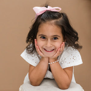 Girl wearing Gold-Plated Pink Pearl Bracelet