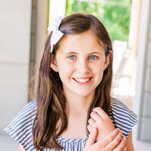 Girl wears Pearl Baby Ring