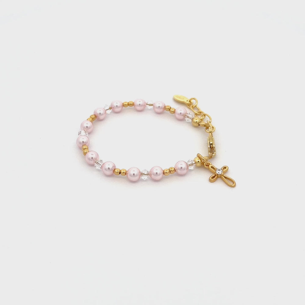 
                
                    Load and play video in Gallery viewer, Lauren  - 14K Gold-Plated Pink Pearl Cross Bracelet for Baby Baptism or Communion Gift
                
            
