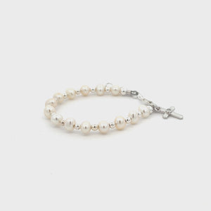 
                
                    Load and play video in Gallery viewer, Kaitlyn - Children&amp;#39;s Sterling Silver Pearl Cross Bracelet
                
            