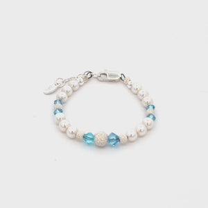 
                
                    Load and play video in Gallery viewer, Kora - Girls Sterling Silver Pearl Baby Bracelet with Aqua Crystals Jewelry for Kids
                
            