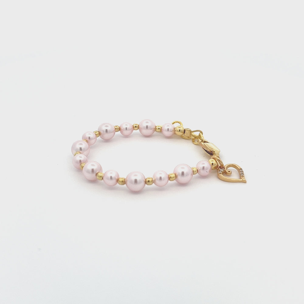 
                
                    Load and play video in Gallery viewer, Larkin - 14K Gold Plated Pink Pearl Child&amp;#39;s Heart Bracelet
                
            