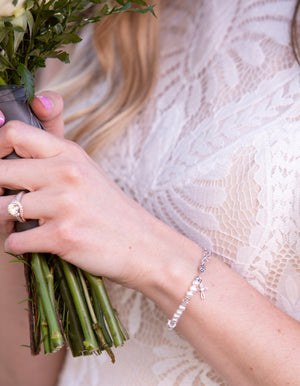 Girl wearing Baptism to Bride Sterling Silver Baptism Bracelet during ceremony